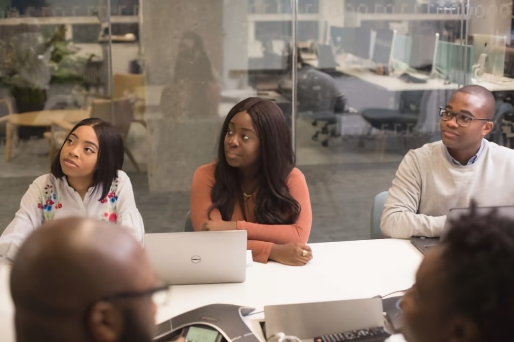 Business people in office on laptop computers