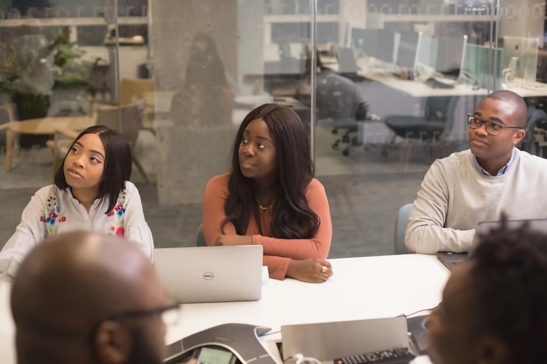 Business people in office on laptop computers