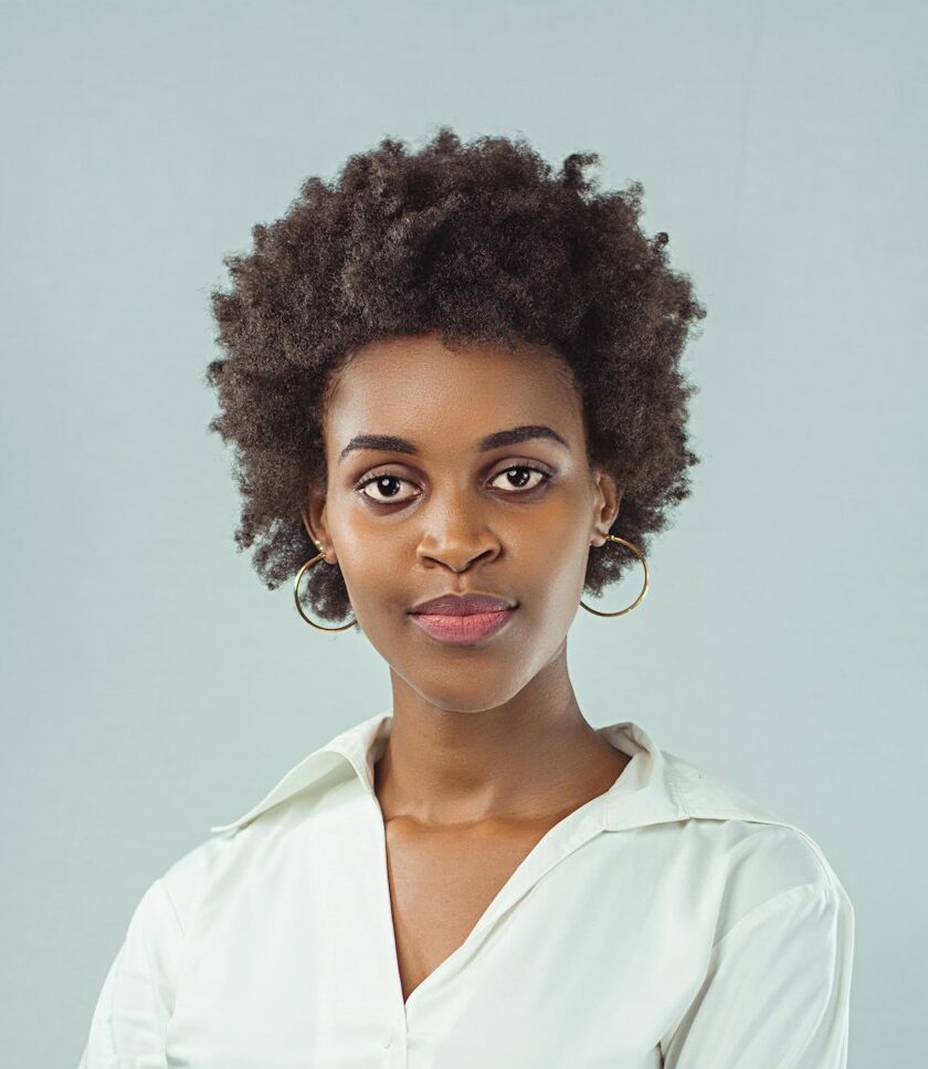 a-woman-in-a-white-shirt-posing-for-a-picture-fl7basyzgxo